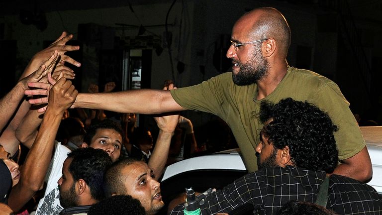 Saif al Islam Gaddafi greeting supporters in Tripoli in 2011. Pic: Reuters