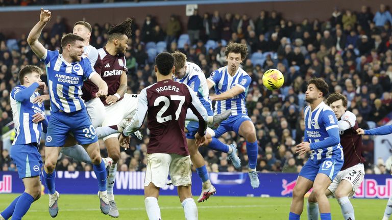 Jack Hinshelwood (centre) scores an own goal to give Villa the lead