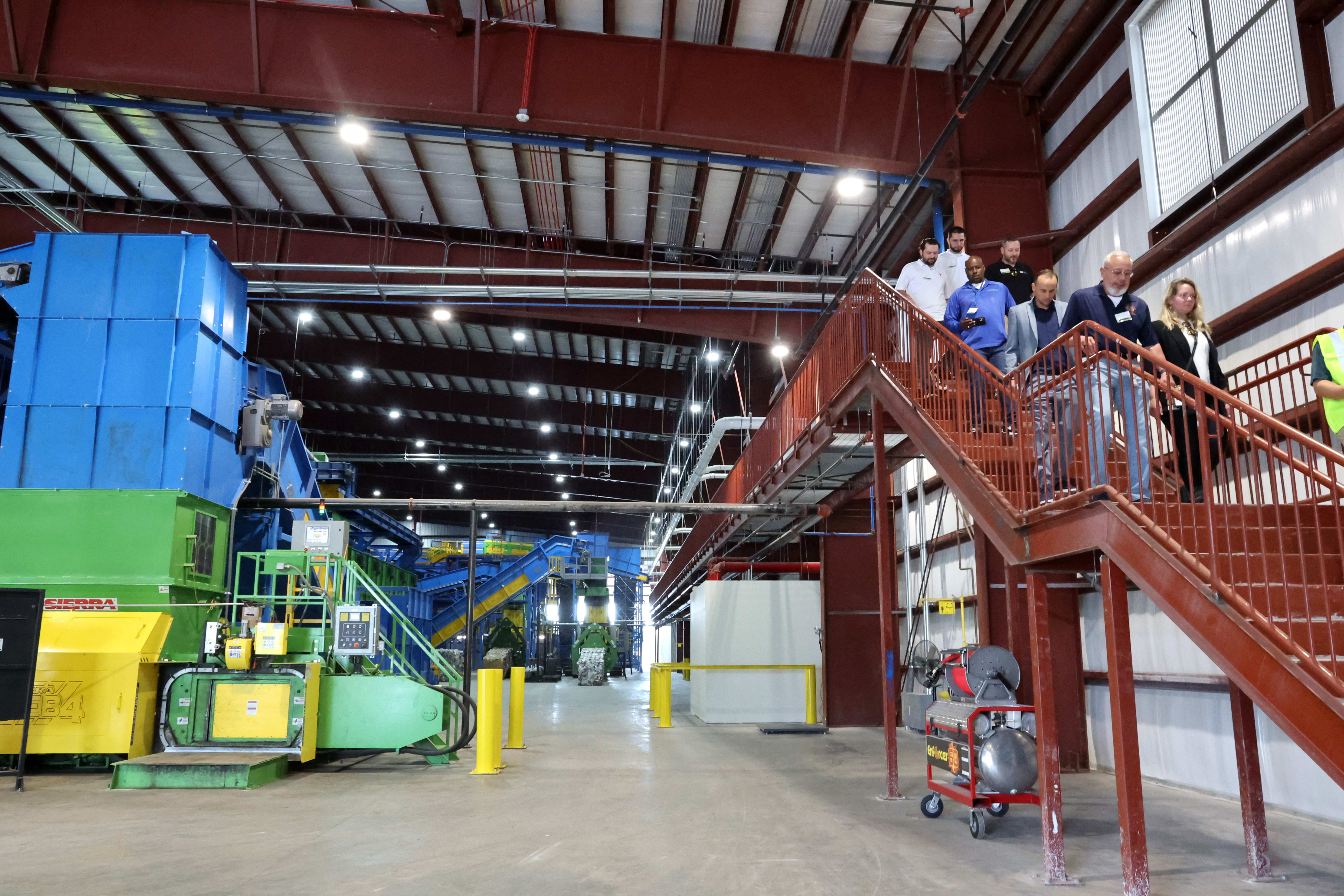 Guests tour the new Waste Management (WM) Recycling South Florida...