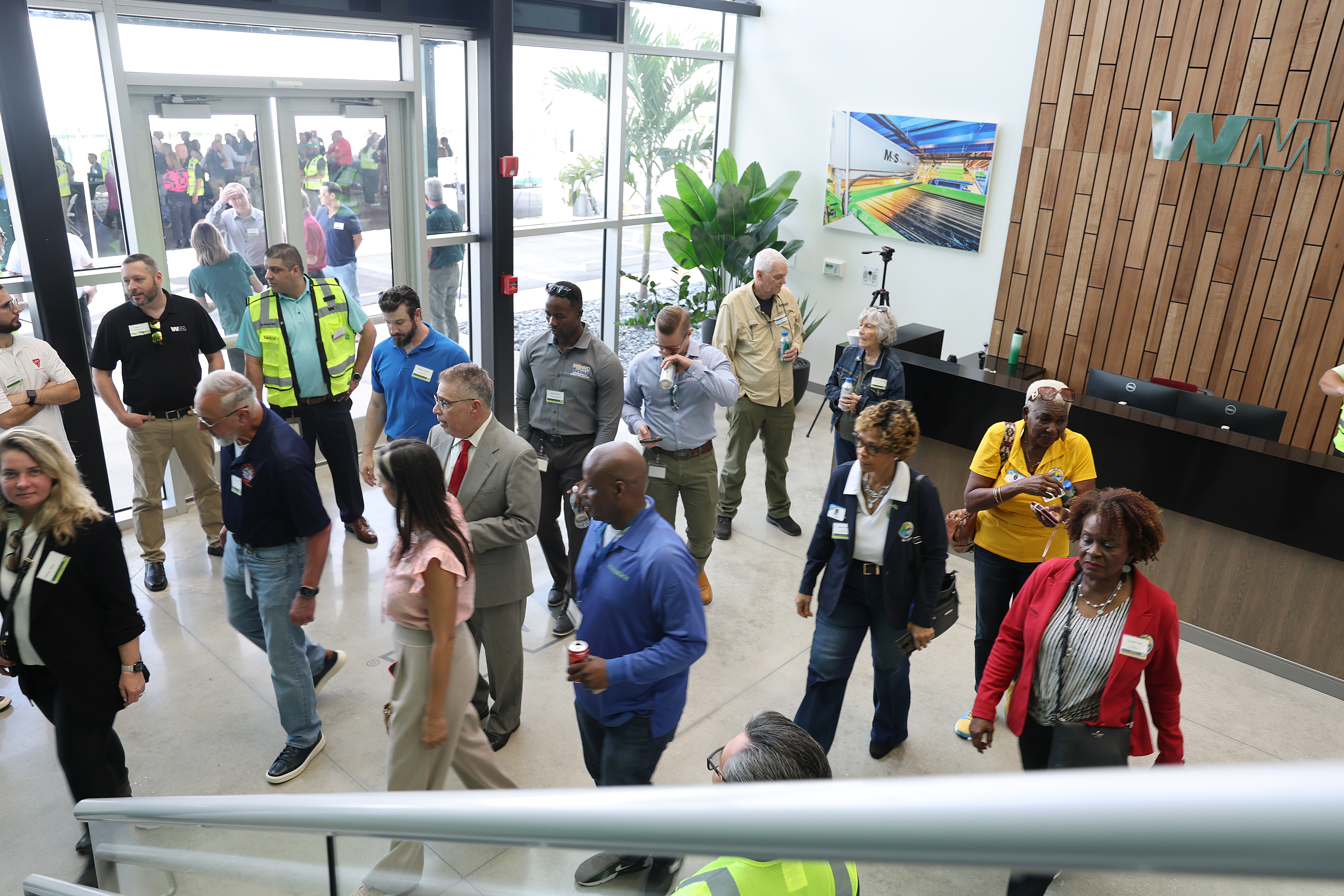 Guests tour the new Waste Management (WM) Recycling South Florida...
