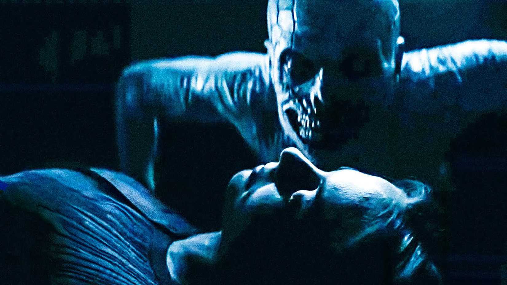 The Mimic sitting close to Willa Holland's Rebecca as she's unconscious in The Mortuary Assistant