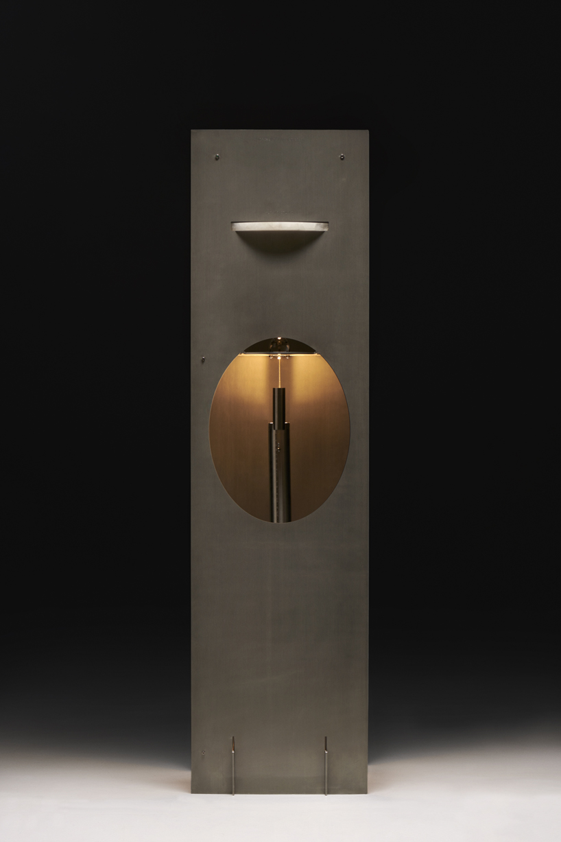 kinetic lighting activates mechanical movement in a sculpture of steel and glass