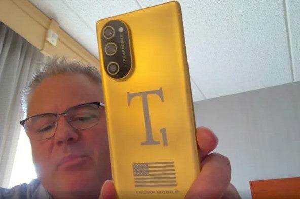 The Trump T1 Phone is shown off by a Trump Mobile executive on a video call.