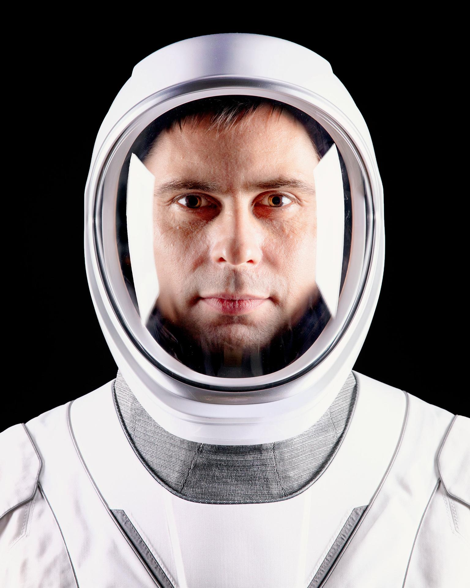A person in a white spacesuit.