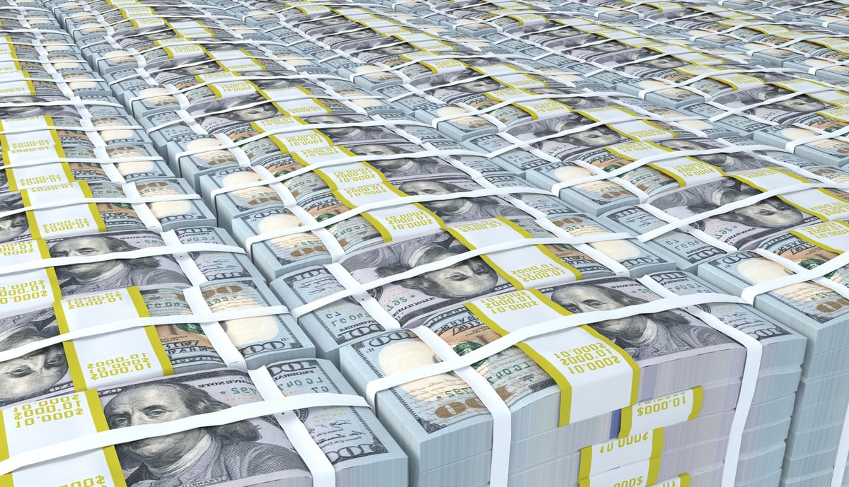 Piles of $100 bills bound into bricks.