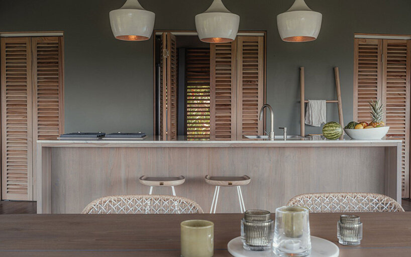 interior kitchen spaces remain visually and physically connected to the outdoors