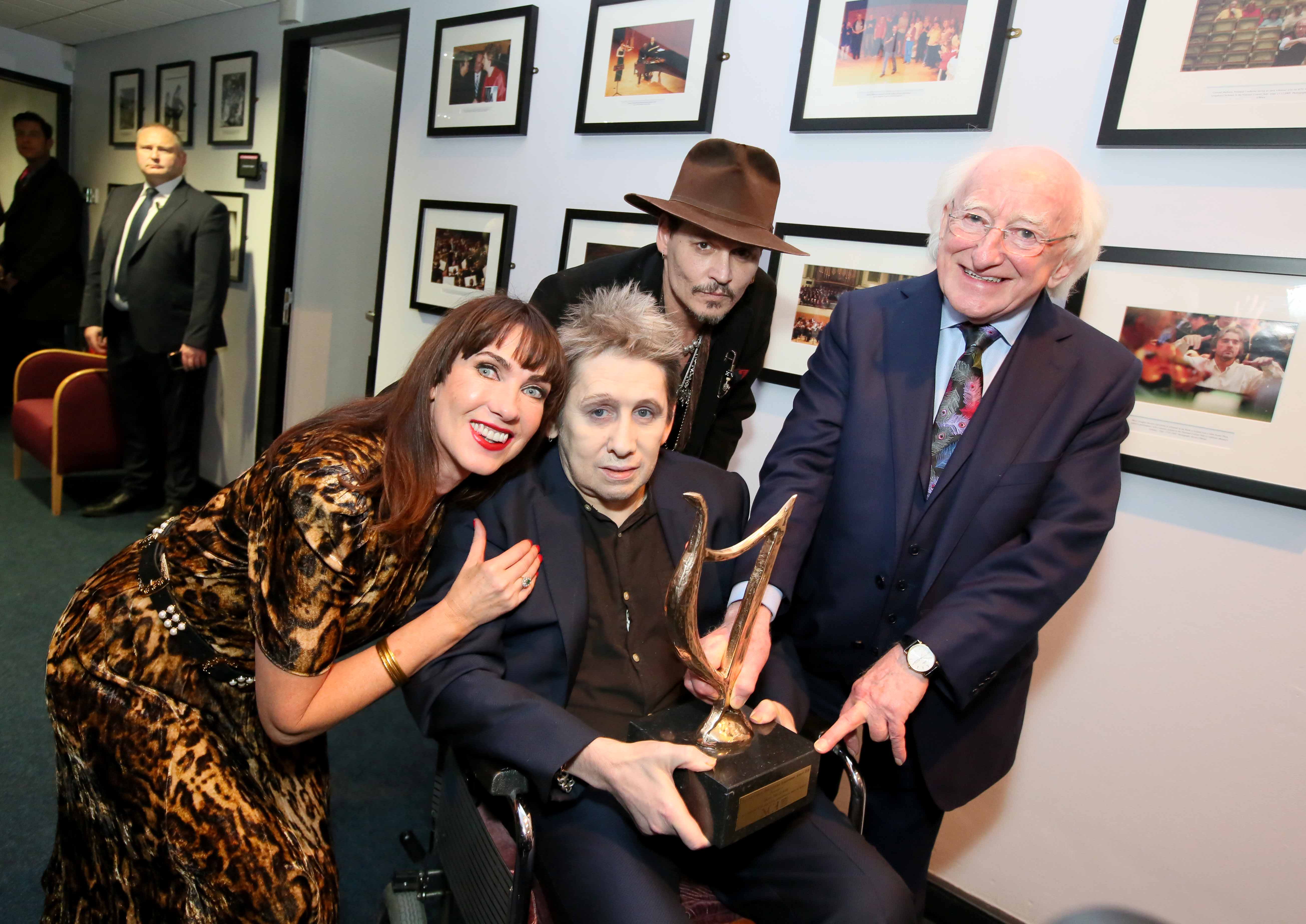 Shane MacGowan, President Michael D. Higgins, Johnny Depp, and Victoria Mary Clarke at MacGowan's 60th birthday celebration.
