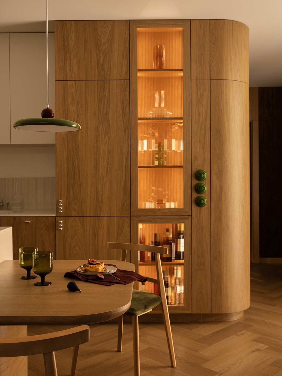 curved bar cabinet and wooden dining table