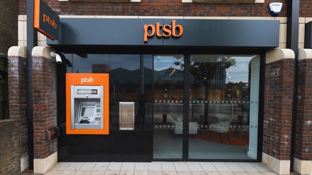 a black and orange ATM machine outside a PTSB branch