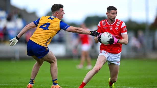 15 June 2025; Ciaran Downey of Louth is tackled by Manus Doherty of Clare during the GAA Football All-Ireland Senior Championship Round 3 match between Louth and Clare at Laois Hire O'Moore Park in Portlaoise, Laois. Photo by Shauna Clinton/Sportsfile