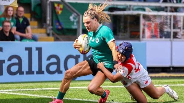 24 August 2025; Beibhinn Parsons of Ireland scores her side's third try despite the efforts of Misaki Matsumura of Japan during the Women's Rugby World Cup 2025 Pool C match between Ireland and Japan at Franklin's Gardens in Northampton, England. Photo by Harry Murphy/Sportsfile
