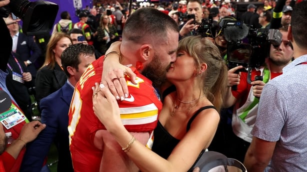Travis Kelce and Taylor Swift embrace 
