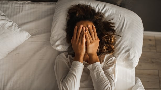 Sad and lonely girl in bedroom. Insomnia and psychological issues. Breakup with boyfriend. Conceptual of bad condition of broken hearted, sadness, loneliness or depress woman.