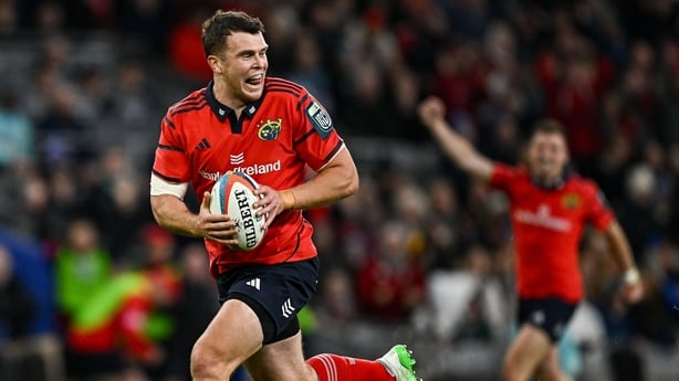 18 October 2025; Tom Farrell of Munster on his way to scoring his side's second try during the United Rugby Championship match between Leinster and Munster at Croke Park in Dublin. Photo by Seb Daly/Sportsfile