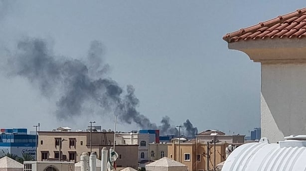 A smoke plume rises over Abu Dhabi from the site of an Iranian missile strike on February 28, 2026. Iranian missiles hit capital cities around the wealthy Gulf on February 28, killing at least one, in retaliation for a US and Israeli attack that threatened to spark a wider conflict. One civilian die