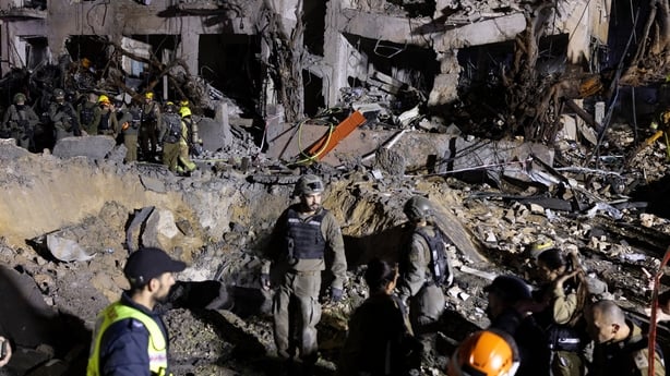 Rescue forces operate at a building hit by an Iranian missile strike in Tel Aviv, Israel, on Sunday, March 1, 2026. President Donald Trump said Iran's supreme leader was killed in US-Israeli airstrikes, raising the stakes in a conflict that's spiraling across the oil-rich Middle East and disrupting 