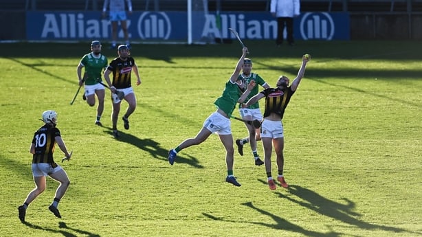 Eoin Cody of Kilkenny catches the sliotar ahead of Matthew Fitzgerald 