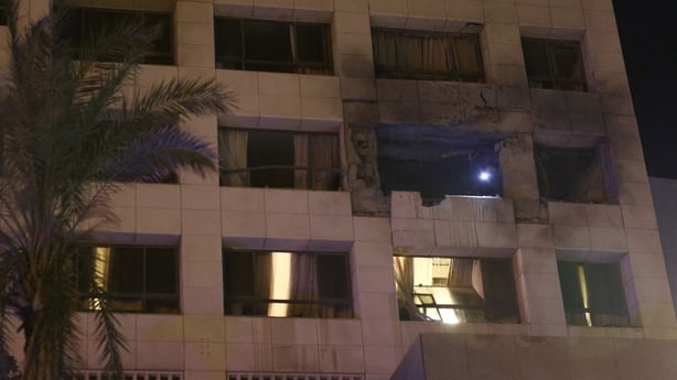 First aid responders inspect a Ramada hotel room targeted by an Israeli strike in Beirut.