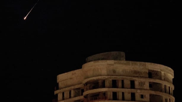 Rocket trails are seen in the sky above Netanya in Israel.
