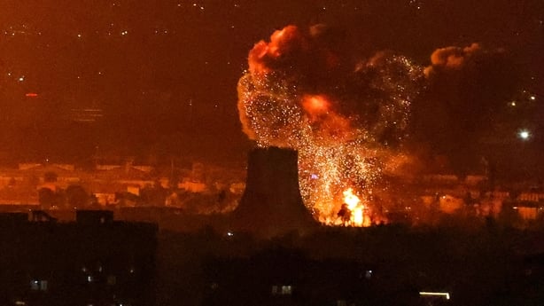 An explosion erupts following strikes near Azadi Tower close to Mehrabad International Airport in Tehran.