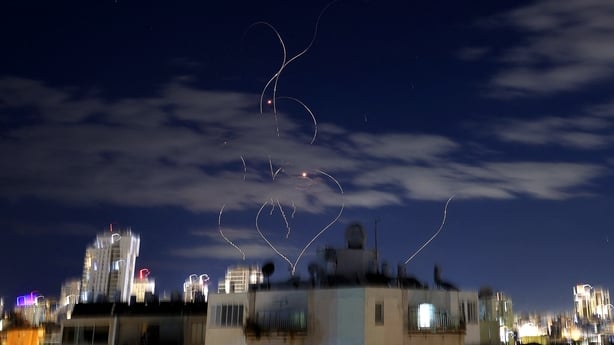 Rocket trails are seen in the sky above the Israeli center coastal city of Netanya.