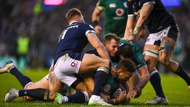 9 February 2025; Jack Conan of Ireland scores his side's fourth try despite the tackles of Duhan van der Merwe and Huw Jones of Scotland during the Guinness Six Nations Rugby Championship match between Scotland and Ireland at Scottish Gas Murrayfield Stadium in Edinburgh, Scotland. Photo by David Fi