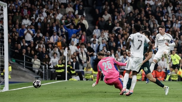 Real Madrid's Uruguayan midfielder #08 Federico Valverde (R) scores his team's third goal during the UEFA Champions League last 16 first leg football match between Real Madrid CF and Manchester City at Santiago Bernabeu Stadium in Madrid on March 11, 2026. (Photo by Oscar DEL POZO / AFP)