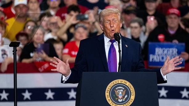 US President Donald Trump speaks at Verst Logistics Contract Packaging Facility in Hebron, Kentucky, US, on Wednesday, March 11, 2026. Trump repeatedly lashed out at Representative Thomas Massie, one of his party's most prominent critics of the Iran war, during a visit to the lawmaker's Kentucky dis