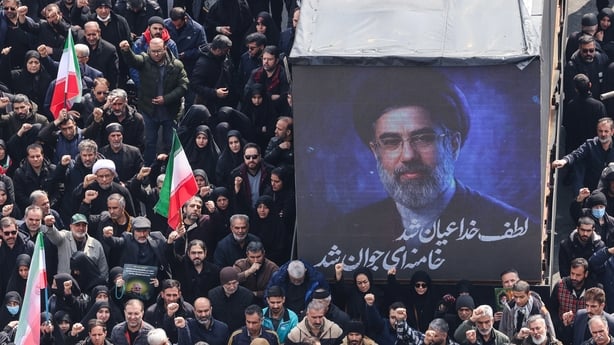A screen displays a portrait of Iran's new supreme leader Mojtaba Khamenei during the funerals of Iran's Revolutionary Guards Corps (IRGC) commanders, army commanders and others killed in the early days of the United States and Israeli strikes on Iran, at Enghelab Square in Tehran on March 11, 2026.