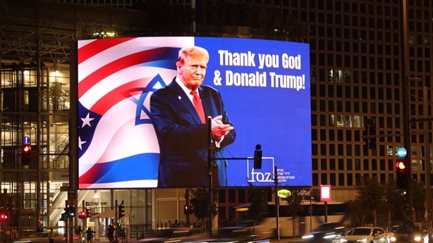 A billboard depicting an image of US President Donald Trump with a message thanking him, is displayed on the side of a building in the Israeli coastal city of Tel Aviv on March 12, 2026. On February 28, Israel and the United States launched strikes on Iran, killing its supreme leader Ayatollah and t