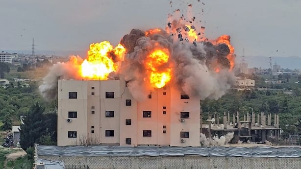 A fireball errupts from the site of an Israeli airstrike that targeted a building in the southern Lebanese village of Abbasiyyeh