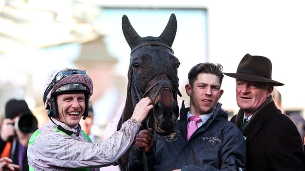 Cheltenham , United Kingdom - 13 March 2026: Trainer Willie Mullins, right, and jockey Paul Townend celebrate with Gaelic Warrior and winning connections after victory in the Boodles Cheltenham Gold Cup Chase on day four of the 2026 Cheltenham Racing Festival at Prestbury Park in Cheltenham, England