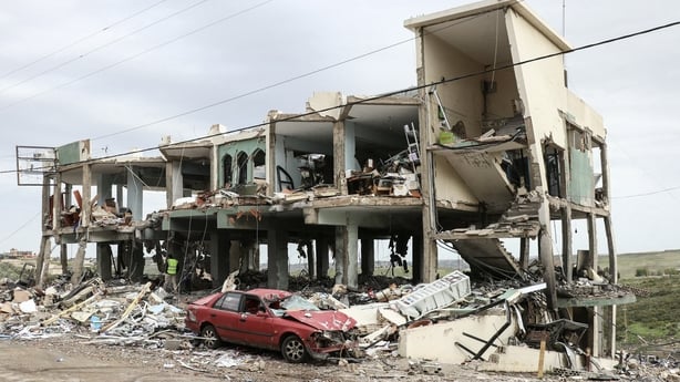 A photograph shows a destroyed healthcare centre building in the aftermath of an Israeli strike on southern Lebanon