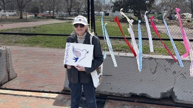 Bonnie Boyle-Coté holding a 'peace' sign 