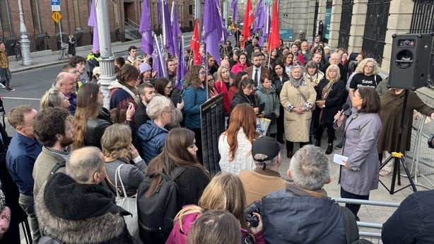 Mary Lou McDonald addresses a crowd of protesters outside Leinster House