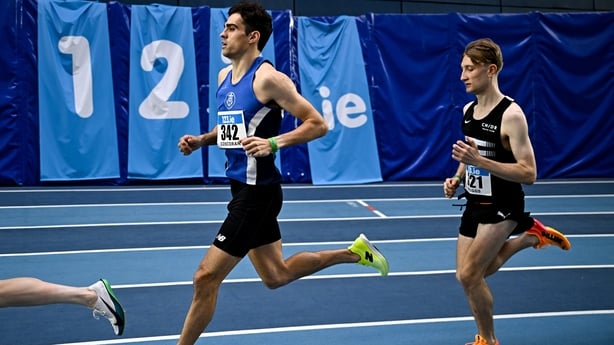1 March 2026; Andrew Coscoran of Star of the Sea AC, Meath, centre, and Nick Griggs of CNDR AC, right, competing in the men's 3000m during day two of the 123.ie National Senior Indoor Championships at the National Indoor Arena on the Sport Ireland Campus in Dublin. Photo by Sam Barnes/Sportsfile 