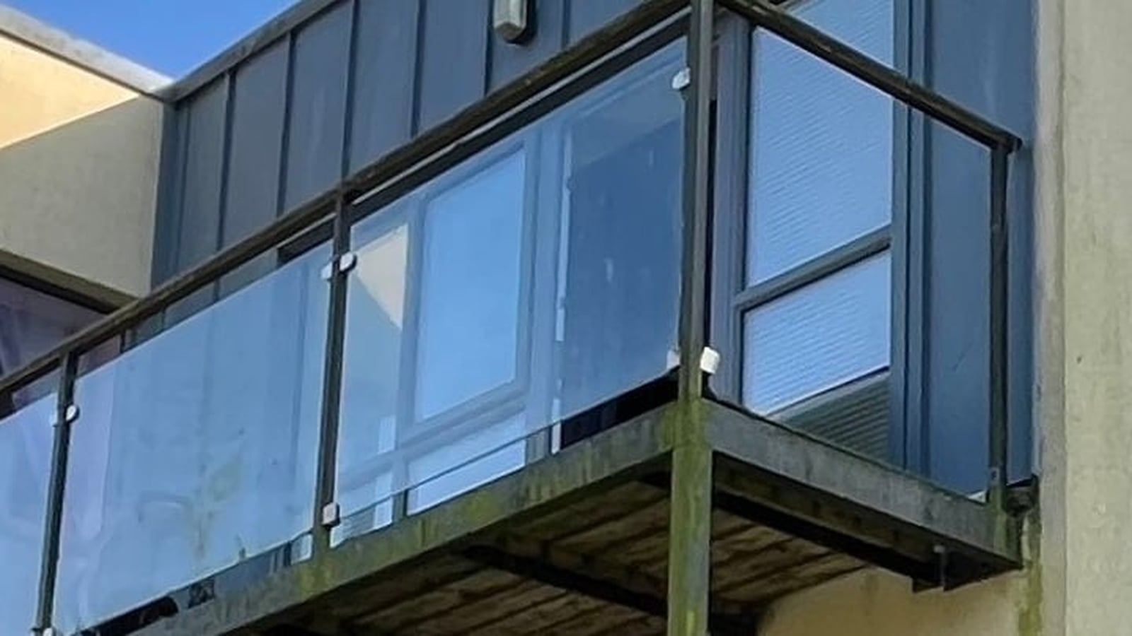 Two children hospitalised after falling from balcony