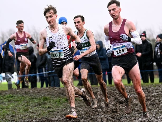 23 November 2025; Nick Griggs of CNDR Track AC, Antrim, left, and Cormac Dalton of Mullingar Harriers AC, Westmeath, compete in the senior men's 7500m during the 123.ie National Cross Country Championships at Templemore Sports Complex in Derry. Photo by Ramsey Cardy/Sportsfile 