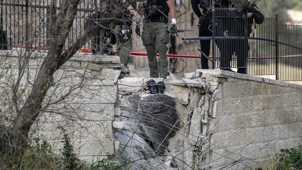 Security forces cordon an area after a piece of a missile fell near the walls of the Old City in Jerusalem