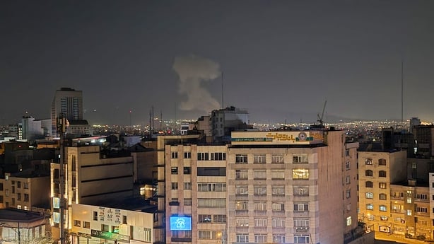 Smoke rise after explosions as the Israeli army announced a new wave of attacks on Tehran
