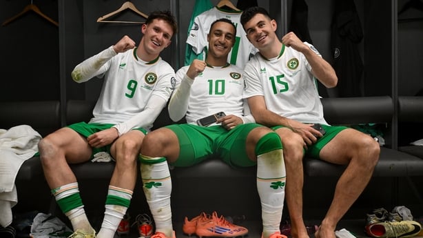 Johnny Kenny, Adam Idah and John Egan of Republic of Ireland celebrate in the dressing room after the FIFA World Cup 2026 Group F Qualifier match between Hungary and Republic of Ireland at Puskás Aréna in Budapest, Hungary.