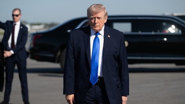 US President Donald Trump walks to speak to reporters before boarding Air Force One at Palm Beach International Airport in West Palm Beach, Florida, on March 23, 2026. President Donald Trump said Monday that there are 