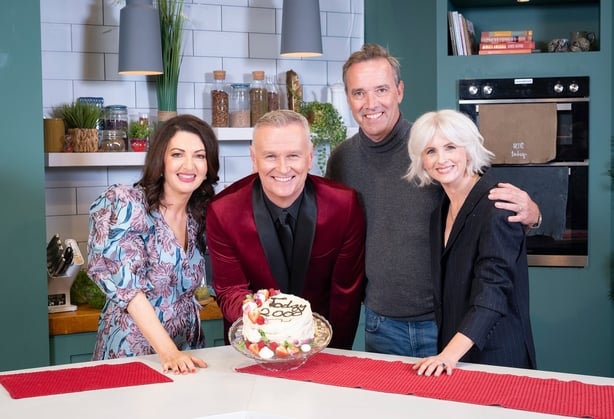 Today hosts Maura Derrane, Daithí Ó Sé and Sinéad Kennedy celebrate with chef Kevin Dundon, who baked them a cake. Photo: Gerard McCarthy