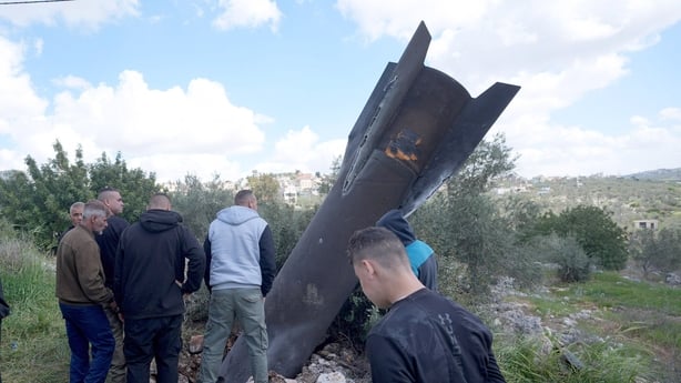 NABLUS, PALESTINE - 2026/03/24: Palestinian residents arrive to inspect the remains of an Iranian missile that landed in agricultural fields near the village of Haris in the northern West Bank. The shrapnel fell in the area after Israel intercepted a barrage of Iranian missiles fired at Israel. Sinc