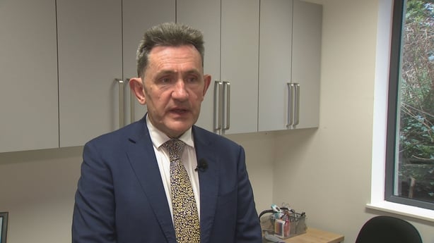 a screengrab shows Dr Diarmuid Quinlan standing in a doctor's surgery