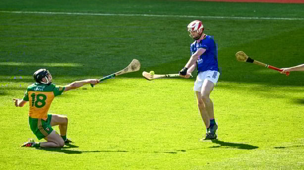 3 June 2023; Seanie Germaine of Wicklow scores a point under pressure from Brian Mc Intyre of Donegal during the Nickey Rackard Cup Final match between Donegal and Wicklow at Croke Park in Dublin. Photo by Harry Murphy/Sportsfile