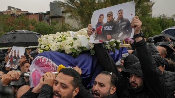 Relatives and friends carry the coffin of Mohammed Ftouni, during the funeral of three Lebanese journalists killed in an Israeli strike