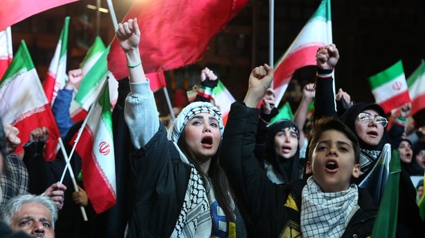 TEHRAN, IRAN - MARCH 30: Iranians gather in Enqelab Square to protest Israeli and U.S. attacks on their country, carrying Iranian flags and photos of Iranian supreme leader Ali Khamenei, who was killed in an airstrike, and chanting slogans against the U.S. and Israel in Tehran, Iran, on March 30, 20