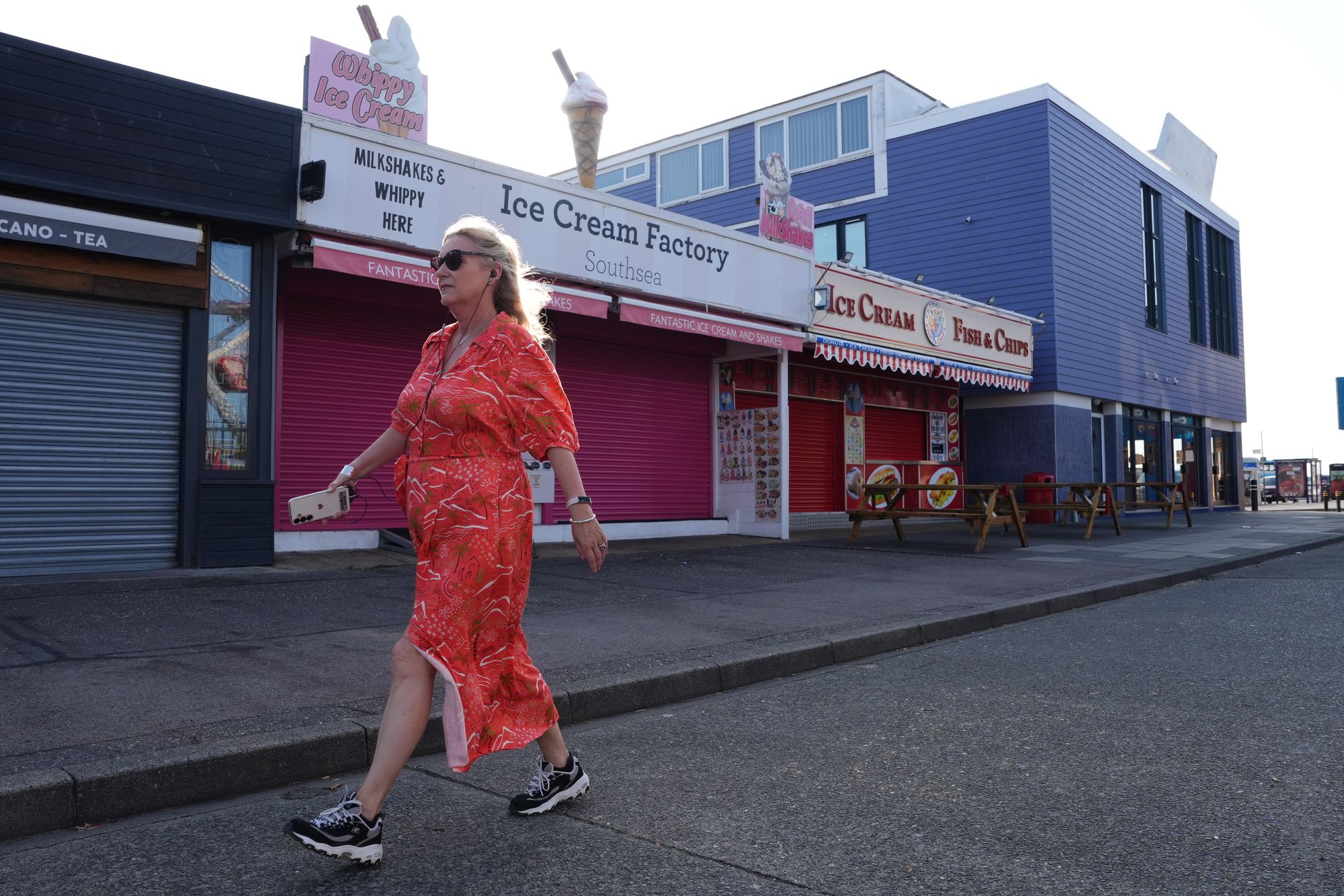 A woman walking at Clarence Pier in Southsea, Portsmouth. Short bursts of exercise that last a few minutes a day - such as running for the bus - could slash the risk of conditions like arthritis, heart disease and dementia, a study suggests