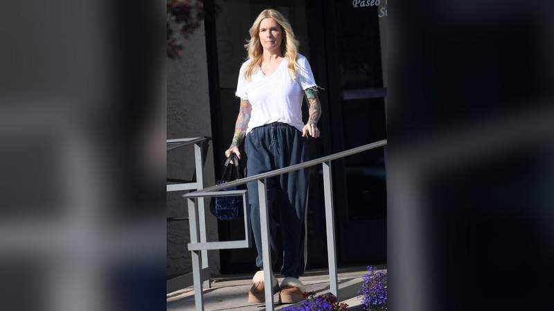 The beach babe's arms are now covered in tattoos.MEGA